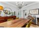 Elegant dining room featuring a wooden table, stylish chandelier, and tasteful decor at 217 Christina Ct, Peachtree City, GA 30269