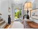 Bright foyer features hardwood floors, a chandelier, and an open view to the beautifully landscaped front yard at 217 Christina Ct, Peachtree City, GA 30269