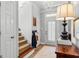 Bright foyer with chandelier, coat hooks, and warm wood accents creates a welcoming entrance at 217 Christina Ct, Peachtree City, GA 30269