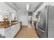 Bright kitchen featuring granite countertops, stainless appliances, and ample storage at 217 Christina Ct, Peachtree City, GA 30269