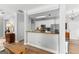 Modern kitchen with white cabinets, stainless steel appliances, and granite countertops at 217 Christina Ct, Peachtree City, GA 30269