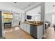 Well-lit kitchen with white cabinets, granite counters, and view to the living area at 217 Christina Ct, Peachtree City, GA 30269
