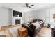 Comfortable living room with a fireplace, leather sofa, and neutral decor at 217 Christina Ct, Peachtree City, GA 30269