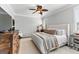 Inviting main bedroom featuring plush bedding, a ceiling fan, and ample space at 217 Christina Ct, Peachtree City, GA 30269