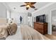 Cozy main bedroom with elegant wooden dresser, wall art, and a view to the hallway at 217 Christina Ct, Peachtree City, GA 30269