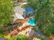 Aerial view showcasing a backyard with an above-ground pool and a spacious wooden deck at 203 Silverwood Way, Peachtree City, GA 30269