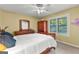 Cozy bedroom with bright natural light, wooden furnishings, and a neutral color scheme at 203 Silverwood Way, Peachtree City, GA 30269