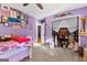 room with playful purple walls, closet, and built-in shelving at 203 Silverwood Way, Peachtree City, GA 30269