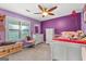bedroom with playful decor, colorful walls, carpet flooring, and white furniture at 203 Silverwood Way, Peachtree City, GA 30269