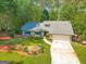 Beautiful single-story home with an attached garage and a landscaped front yard at 203 Silverwood Way, Peachtree City, GA 30269