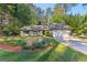 Beautiful one-story house with an attached garage, garden, and well-kept lawn at 203 Silverwood Way, Peachtree City, GA 30269