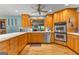 Well-designed kitchen with stainless steel appliances, ample counter space, and updated cabinets at 203 Silverwood Way, Peachtree City, GA 30269