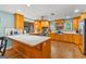 Bright and airy kitchen with light-colored cabinets, stainless steel appliances, and hardwood floors at 203 Silverwood Way, Peachtree City, GA 30269