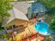 Backyard aerial view featuring an inviting deck area and an above ground pool for outdoor enjoyment at 203 Silverwood Way, Peachtree City, GA 30269