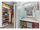 Vanity area near a walk-in closet, with a stool, lighting, and full mirror at 203 Silverwood Way, Peachtree City, GA 30269