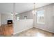 Cozy dining area with chandelier, tile flooring, and a view of the living area at 2550 Columbia Crossing Ct, Decatur, GA 30034