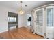 Elegant dining room featuring hardwood floors, chandelier, and display cabinet at 2550 Columbia Crossing Ct, Decatur, GA 30034