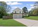 Charming two-story home with a two-car garage and well-manicured lawn at 2550 Columbia Crossing Ct, Decatur, GA 30034