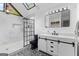 Beautiful bathroom with modern black fixtures and white walls and decorative black and white tiling at 608 E Banks Rd, Fayetteville, GA 30214