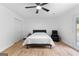 Cozy bedroom featuring a comfortable bed, accent chair, closet, and access to a backyard at 608 E Banks Rd, Fayetteville, GA 30214