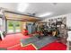 Large garage with double doors, and lots of organized tools and storage in a well-lit space at 608 E Banks Rd, Fayetteville, GA 30214