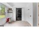 Bright laundry room with LG washer and dryer, tile floor, and a window view to the property's yard at 608 E Banks Rd, Fayetteville, GA 30214