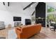 Bright living room featuring wood floors, stone fireplace, and a vaulted ceiling at 608 E Banks Rd, Fayetteville, GA 30214