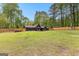 Great single Gathering home showing a spacious backyard with mature landscaping and covered patios at 608 E Banks Rd, Fayetteville, GA 30214