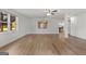 Finished basement showcasing wood-look floors, recessed lighting, and large windows at 103 Wisteria Way, Stockbridge, GA 30281