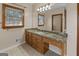 Bathroom with a large vanity with a granite countertop, window, and great natural light at 103 Wisteria Way, Stockbridge, GA 30281