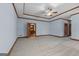 Large primary bedroom with a trey ceiling, fan, and view to the kitchen and dining room at 103 Wisteria Way, Stockbridge, GA 30281