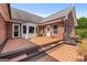 Spacious deck with stairs down, and a view of the backyard and the house at 103 Wisteria Way, Stockbridge, GA 30281