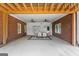 Covered brick patio featuring a dining area with ceiling fans, brick columns, and a concrete floor at 103 Wisteria Way, Stockbridge, GA 30281