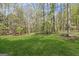 Spacious backyard with a well-kept lawn, perfect for outdoor activities and relaxation at 185 Cold Harbor Ct, Sharpsburg, GA 30277