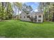 Expansive backyard featuring a well-maintained lawn and a glimpse of the home's exterior at 185 Cold Harbor Ct, Sharpsburg, GA 30277