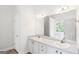 Bathroom featuring double sinks, white cabinets, and ample counter space at 185 Cold Harbor Ct, Sharpsburg, GA 30277