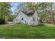 Well-maintained home with a lush green lawn and mature trees creating a peaceful, private setting at 185 Cold Harbor Ct, Sharpsburg, GA 30277