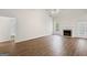Spacious living room with vaulted ceiling, fireplace, wood floors, and lots of natural light at 185 Cold Harbor Ct, Sharpsburg, GA 30277
