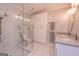 Beautiful bathroom featuring double sinks, marble floors and shower, and white cabinets for lots of storage at 230 Haynes Rd, Moreland, GA 30259