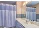 Bathroom featuring a shower curtain and a white vanity and sink at 230 Haynes Rd, Moreland, GA 30259