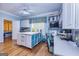 Large craft room with hardwood floors, custom storage, a ceiling fan, and lots of natural light at 230 Haynes Rd, Moreland, GA 30259