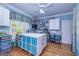 Large craft room with hardwood floors, custom storage, a ceiling fan, and lots of natural light at 230 Haynes Rd, Moreland, GA 30259