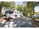 Spacious two-story home with a large lot surrounded by mature trees and an expansive driveway at 230 Haynes Rd, Moreland, GA 30259
