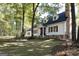 Charming two-story home featuring dormer windows, stone accents, and a well-manicured lawn at 230 Haynes Rd, Moreland, GA 30259