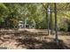 Two-story house with a large front yard surrounded by trees at 230 Haynes Rd, Moreland, GA 30259