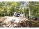 A two-story home situated on a wooded lot, featuring an expansive yard and plenty of natural light at 230 Haynes Rd, Moreland, GA 30259