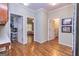 Hallway showcasing hardwood floors and multiple doorways leading to other rooms in the home at 230 Haynes Rd, Moreland, GA 30259
