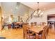 Open-concept design with dining room, staircase, and hardwood floors at 230 Haynes Rd, Moreland, GA 30259