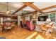 Inviting living room features exposed beams, fireplace, and built-in shelving at 230 Haynes Rd, Moreland, GA 30259