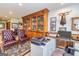 Office area boasts custom cabinetry, comfortable leather seating and natural light at 230 Haynes Rd, Moreland, GA 30259